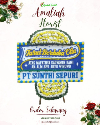 Papan Bunga Duka di Pinggir Air
